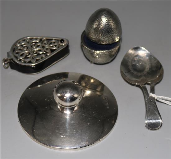 A George III silver caddy spoon (a.f.) and three other items including a silver lid.